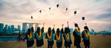 College graduates throwing up their caps